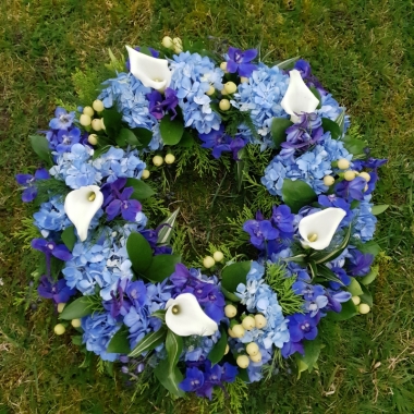 blue and white funeral wreath