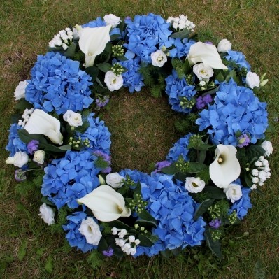 blue and white funeral wreath