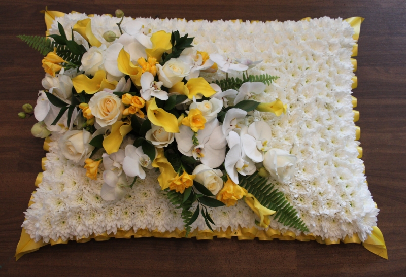 yellow and white funeral pillow