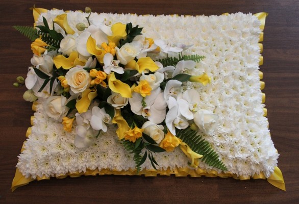 yellow and white funeral pillow