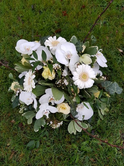 white and green funeral round posy arrangement