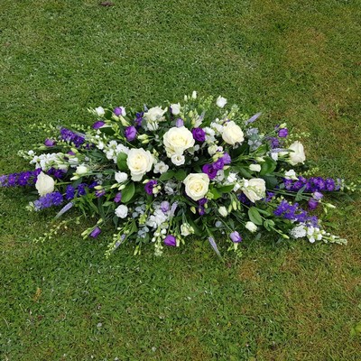 Purple and white coffin spray