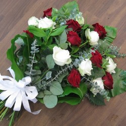 red and white rose tied sheaf