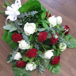 red and white rose tied sheaf