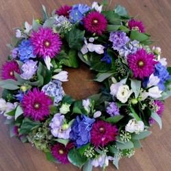 Mauve Lilac round funeral Wreath