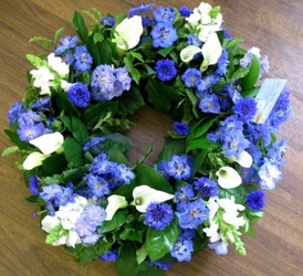 blue and white funeral wreath