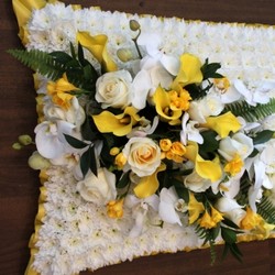 yellow and white funeral pillow