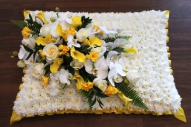 yellow and white funeral pillow
