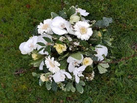 white and green funeral round posy arrangement