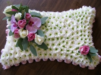 pink and white funeral pillow