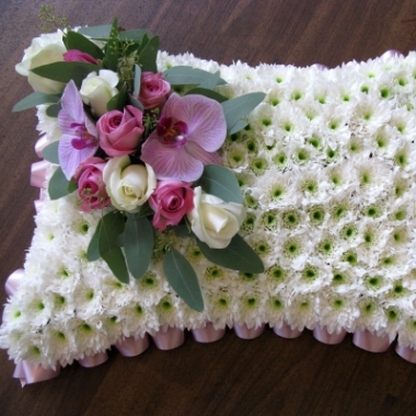 pink and white funeral pillow