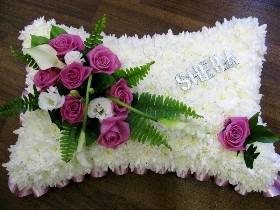 pink and white funeral pillow