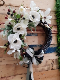 White faux flower door wreath