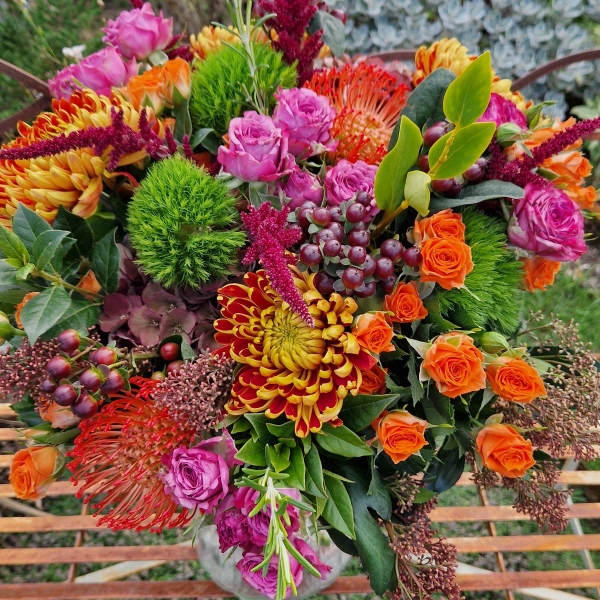 Autumn bouquet with chrysanthemum blooms, roses, and rich seasonal foliage, inspired by the South Downs