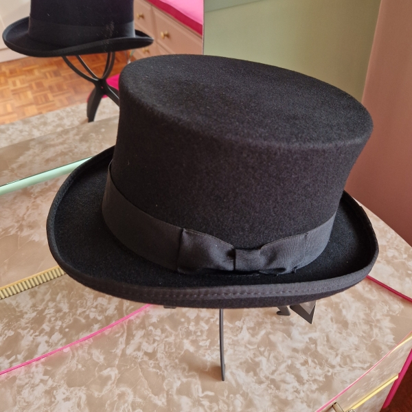 Black top hat with steampunk goggles