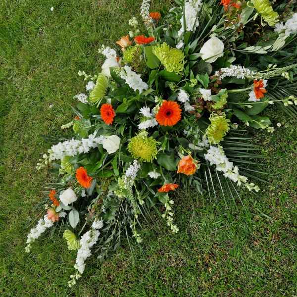 Funeral coffin spray, seasonal flowers in the colours of the Irish flag