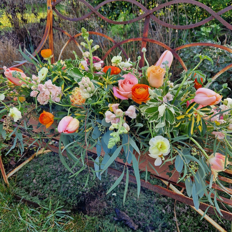 Coffin meadow box design, seasonal flowers in apricot tones