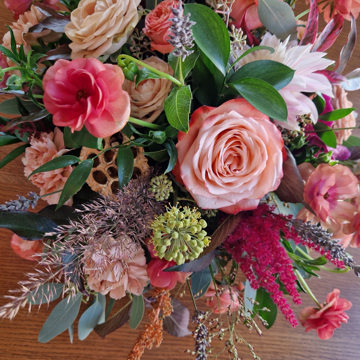 Berwick in Autumn bouquet with Kahala roses, berries and grasses in soft seasonal tones