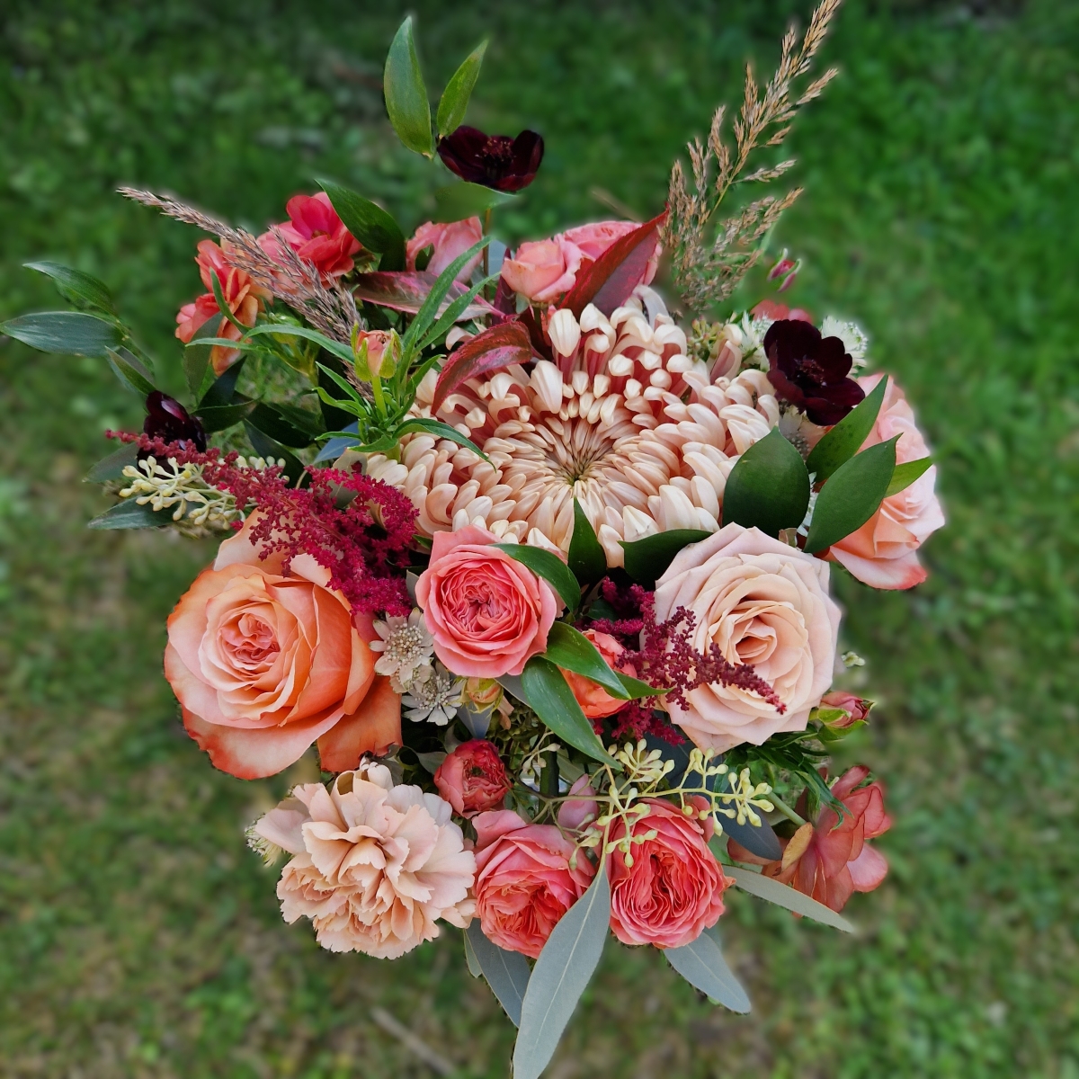 Berwick in Autumn bouquet with Kahala roses, berries and grasses in soft seasonal tones