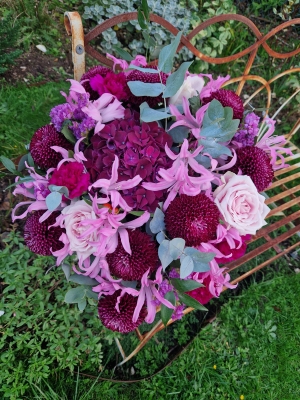Chyngton autumn bouquet in rich pink and plum tones, featuring nerines, chrysanthemum blooms, roses, carnations, and statice in a lush, seasonal arrangement
