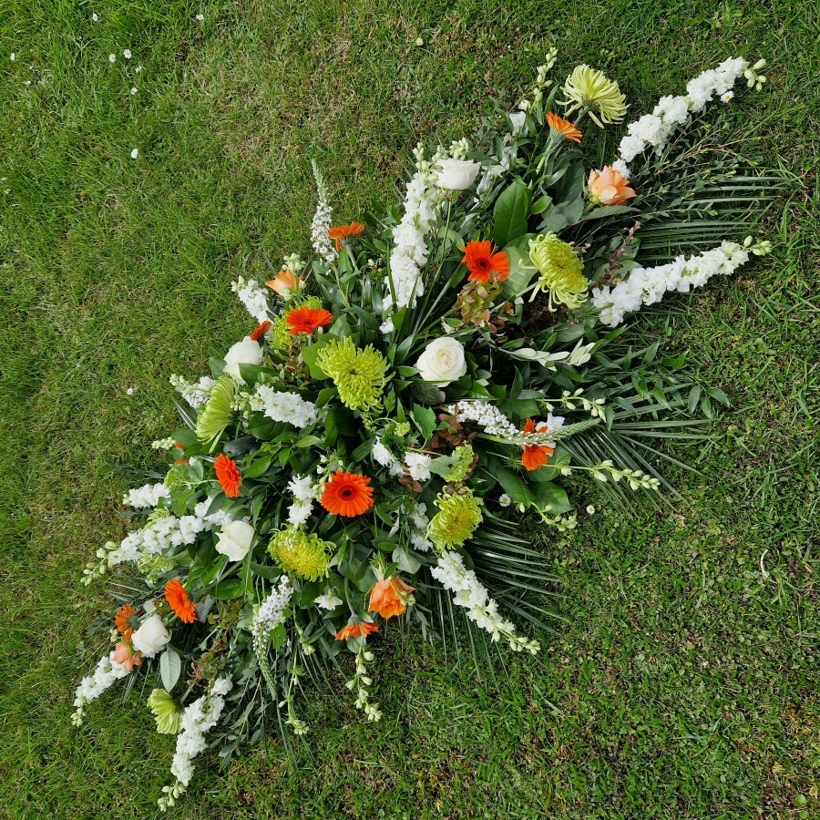 Funeral coffin spray, seasonal flowers in the colours of the Irish flag