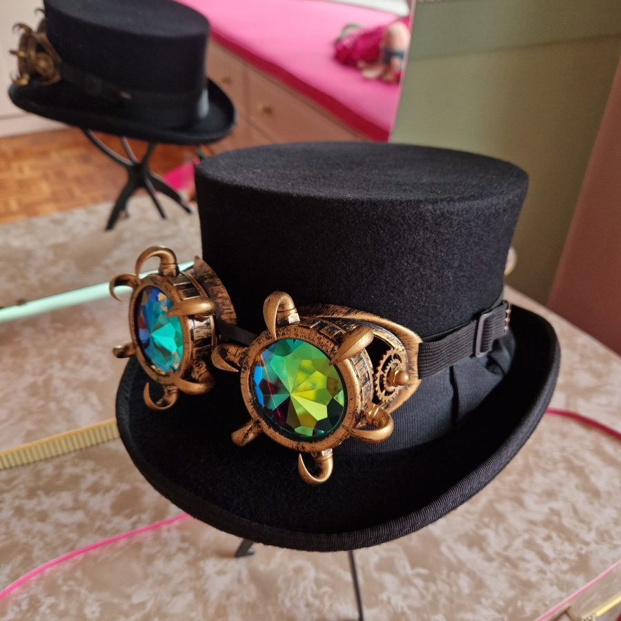 Black top hat with steampunk goggles