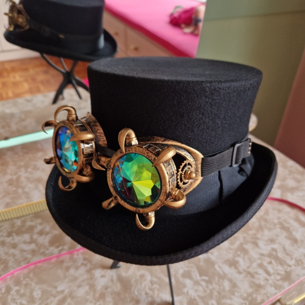 Black top hat with steampunk goggles