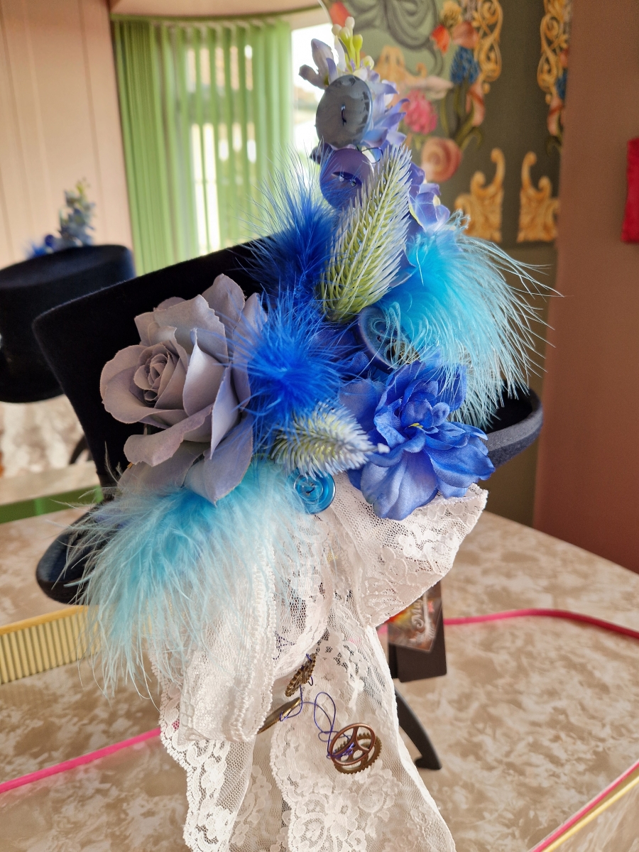 Navy wool top hat with structured crown and detachable faux flowers, or Goggles ideal for weddings or steampunk events.