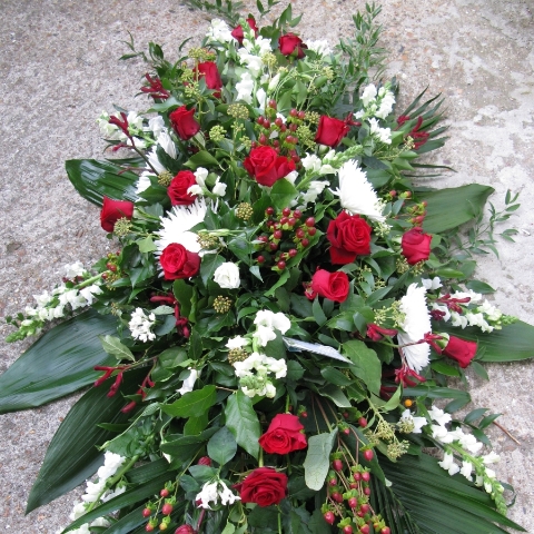 Seasonal Red Rose funeral coffin spray