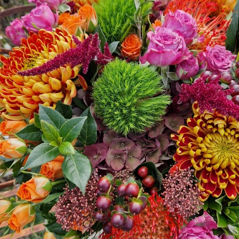 Autumn bouquet with chrysanthemum blooms, roses, and rich seasonal foliage, inspired by the South Downs