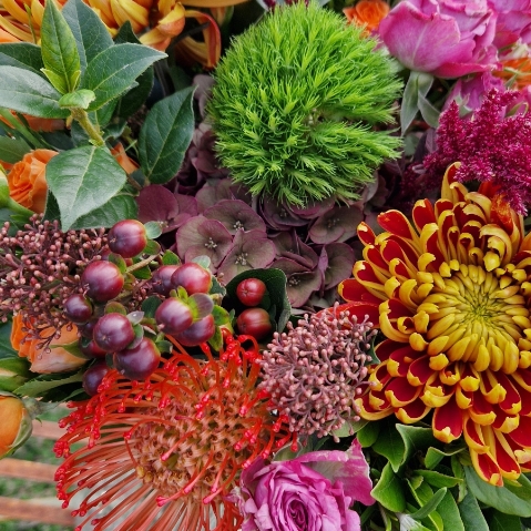Autumn bouquet with chrysanthemum blooms, roses, and rich seasonal foliage, inspired by the South Downs