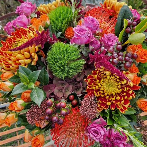 Autumn bouquet with chrysanthemum blooms, roses, and rich seasonal foliage, inspired by the South Downs