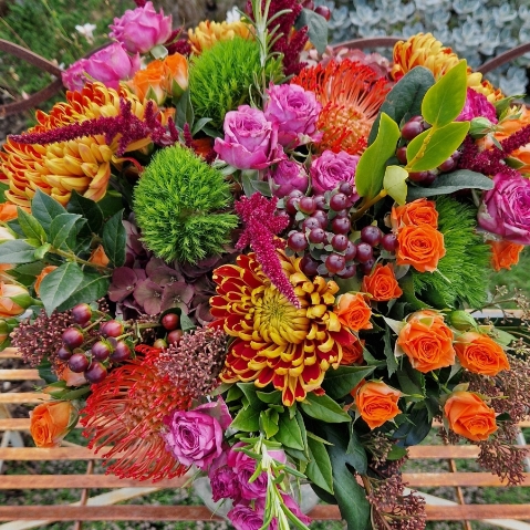 Autumn bouquet with chrysanthemum blooms, roses, and rich seasonal foliage, inspired by the South Downs