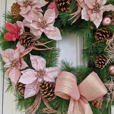 Faux pink poinsettia Christmas wreath with rose gold shimmer, faux apples, pine cones, and a 50cm faux pine base