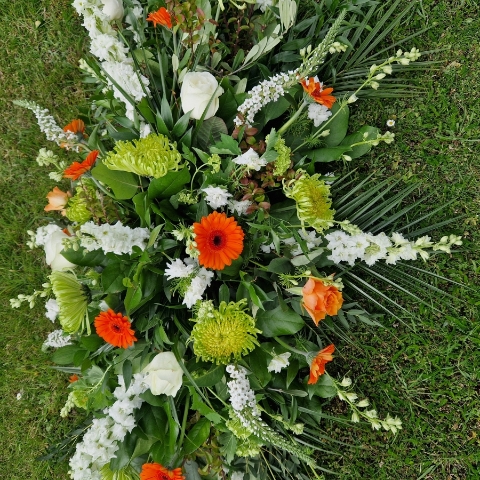 Funeral coffin spray, seasonal flowers in the colours of the Irish flag