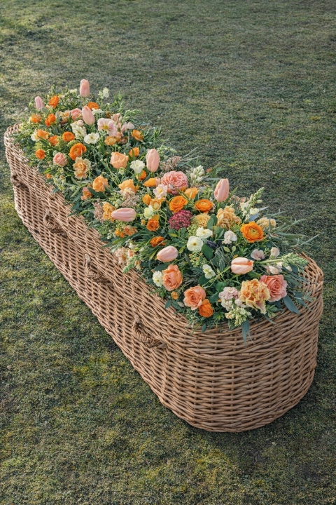 Coffin meadow box design, seasonal flowers in apricot tones