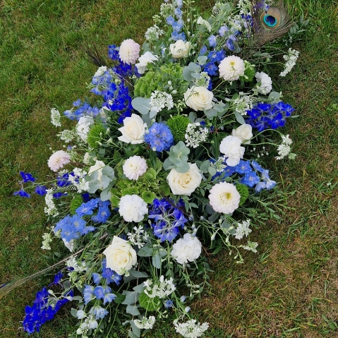 Seasonal blue and white coffin spray