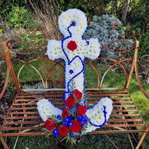 Bespoke funeral tribute in the shape of an anchor in red, white and blue