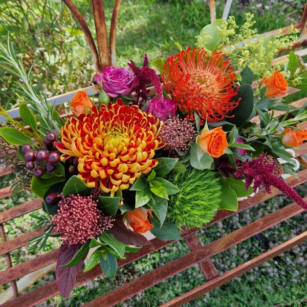 Autumn Downs jute trough arrangement with rust chrysanthemums, roses, seasonal berries and grasses