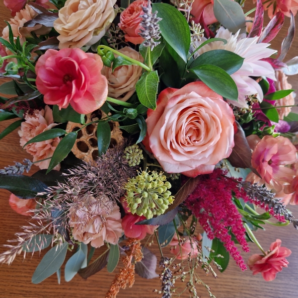 Berwick in Autumn bouquet with Kahala roses, berries and grasses in soft seasonal tones