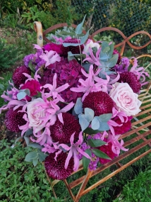 Chyngton autumn bouquet in rich pink and plum tones, featuring nerines, chrysanthemum blooms, roses, carnations, and statice in a lush, seasonal arrangement