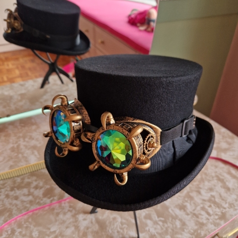 Black top hat with steampunk goggles