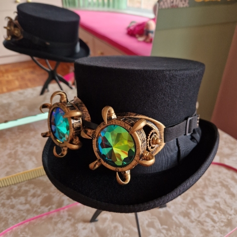 Black top hat with steampunk goggles