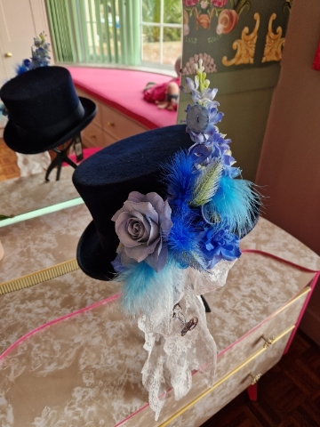 Navy wool top hat with structured crown and detachable faux flowers, or Goggles ideal for weddings or steampunk events.